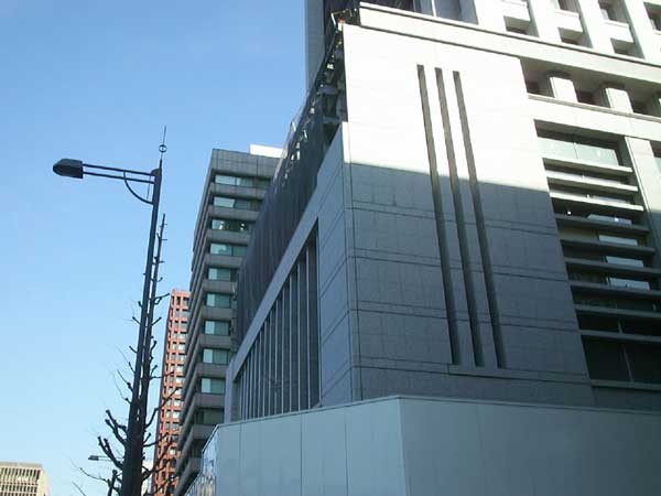 Meiji Yasuda Seimei building base white granite another angle